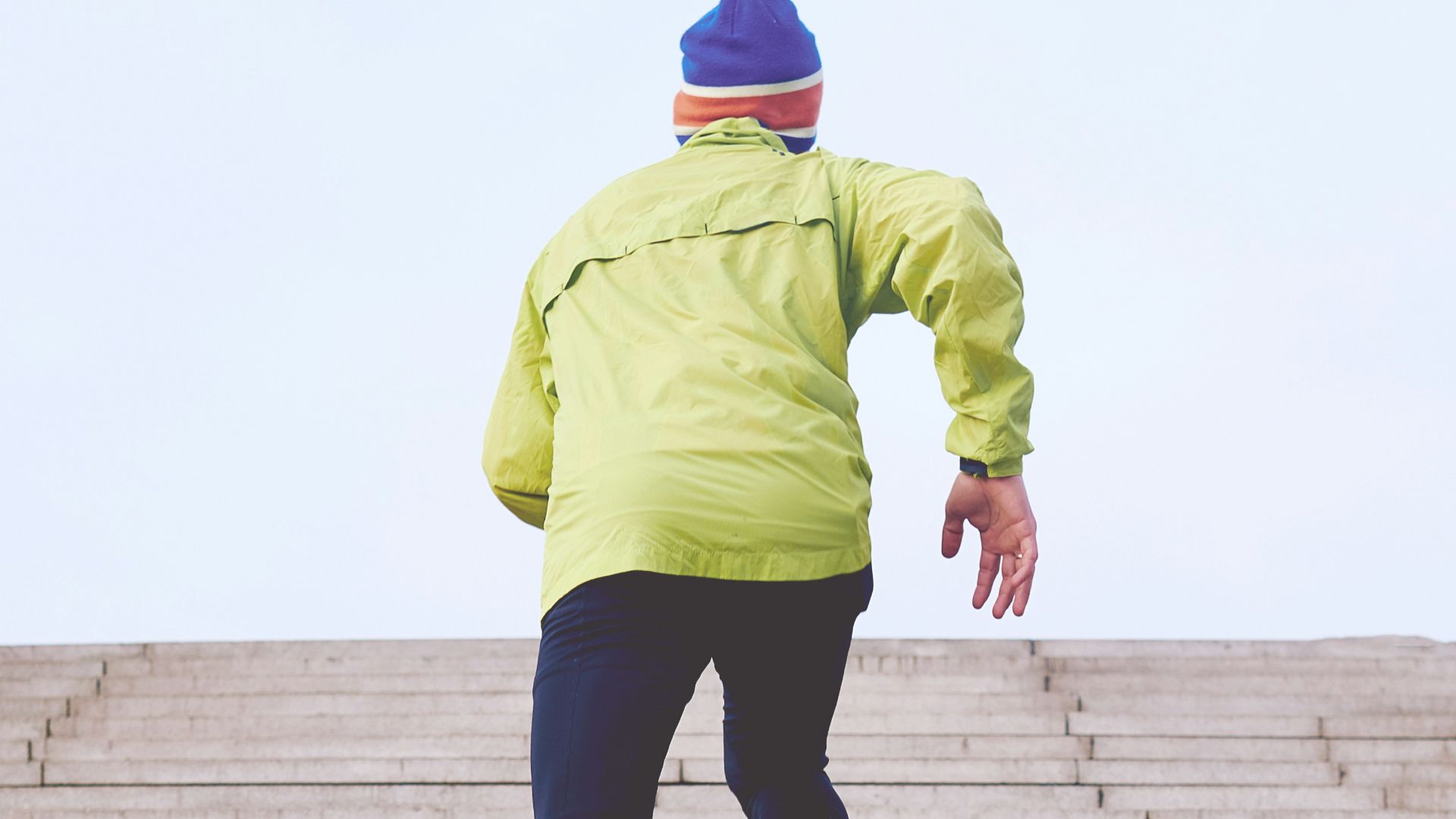 person climbing concrete stairs