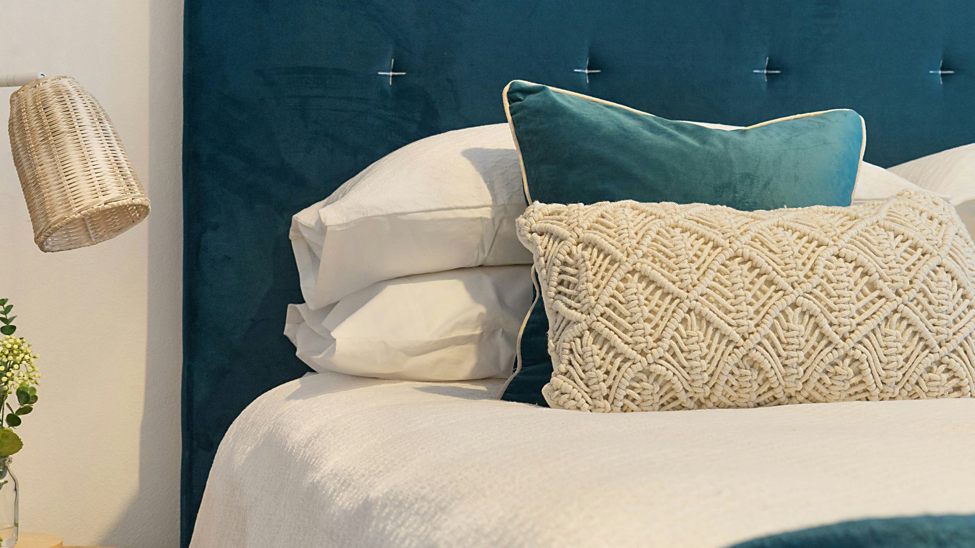 blue bed and mattress with pillows