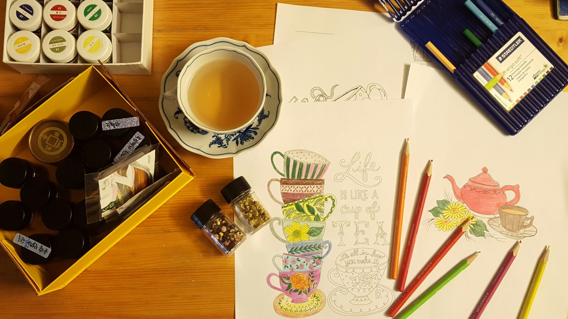 black and white ceramic mug on brown wooden table