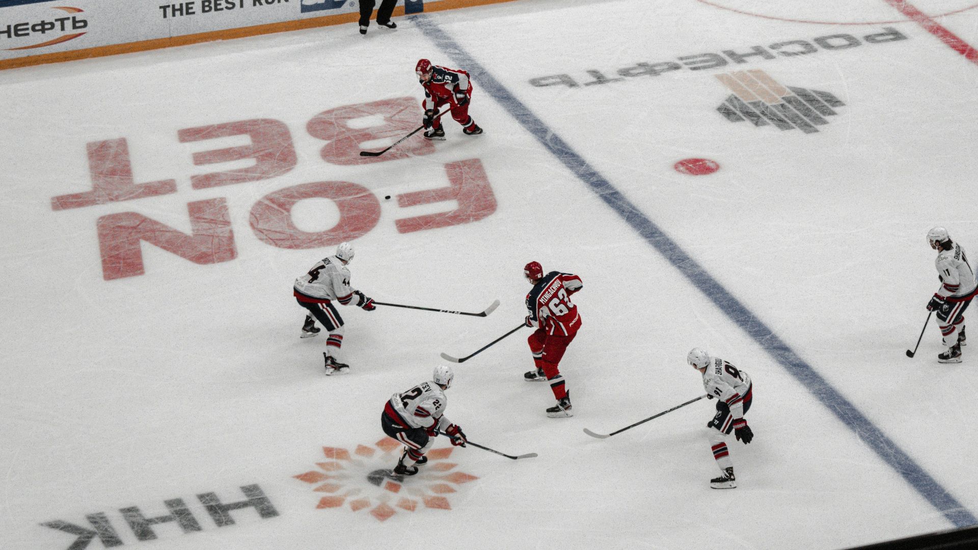 people playing ice hockey on ice hockey field