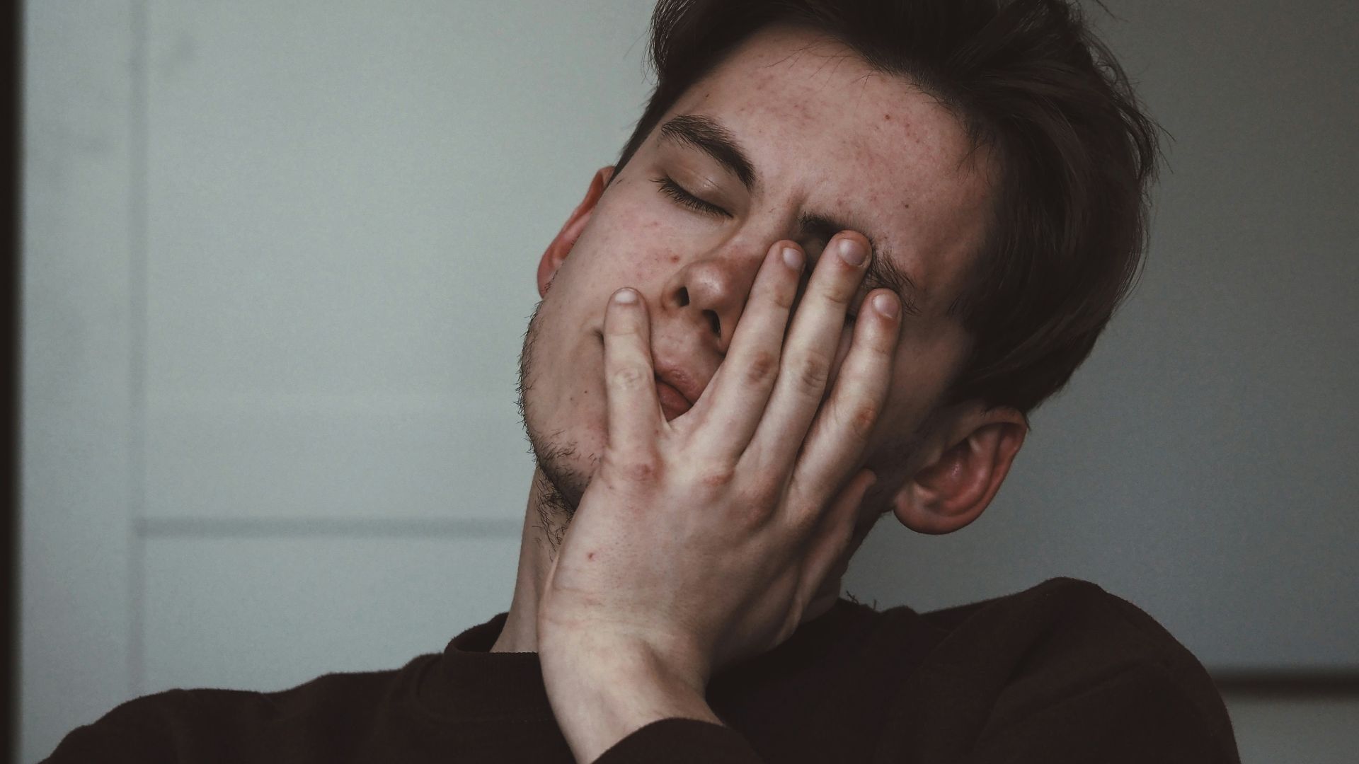 man wearing black crew-neck top