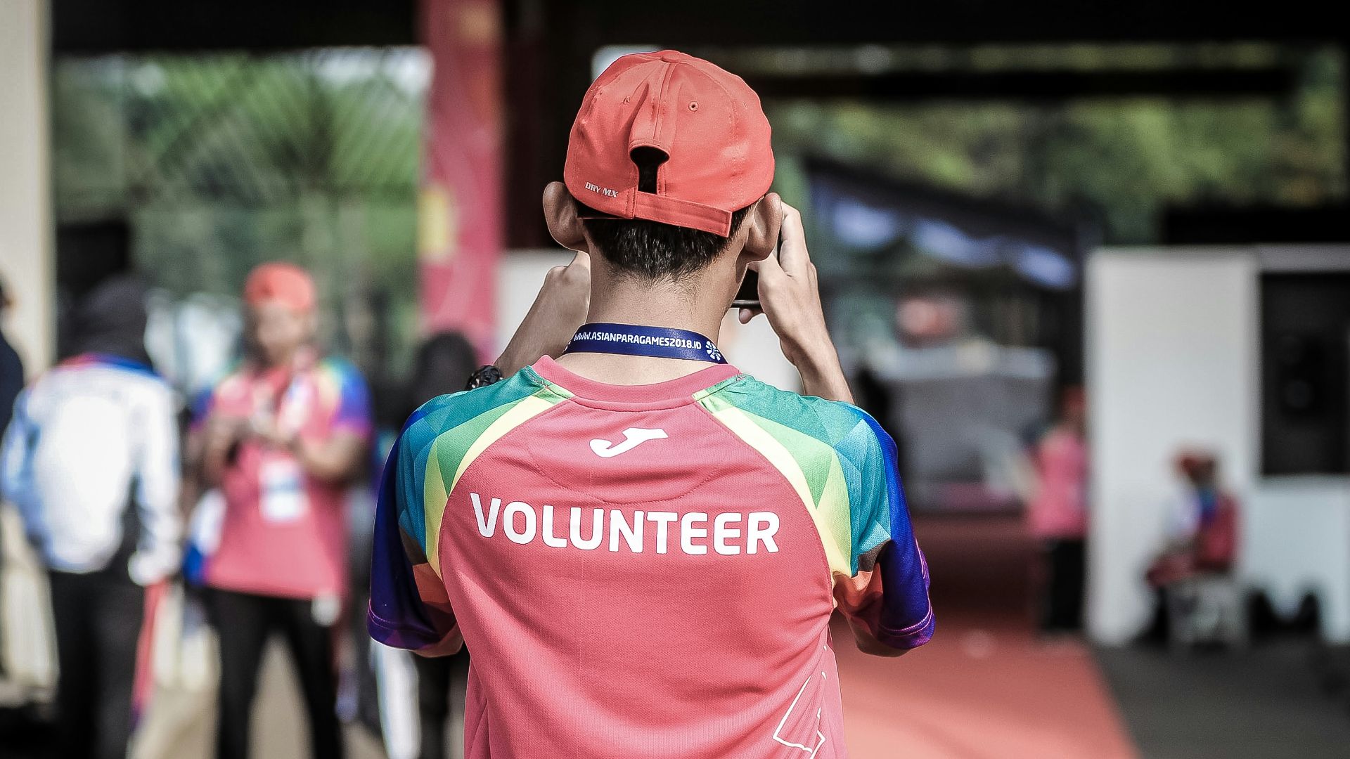 person standing wearing red shirt