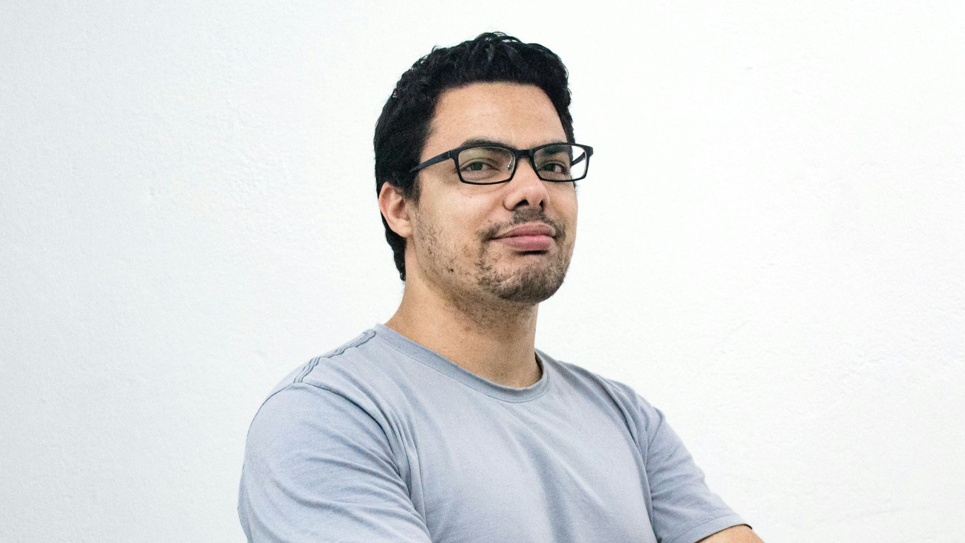 man crossing both arms