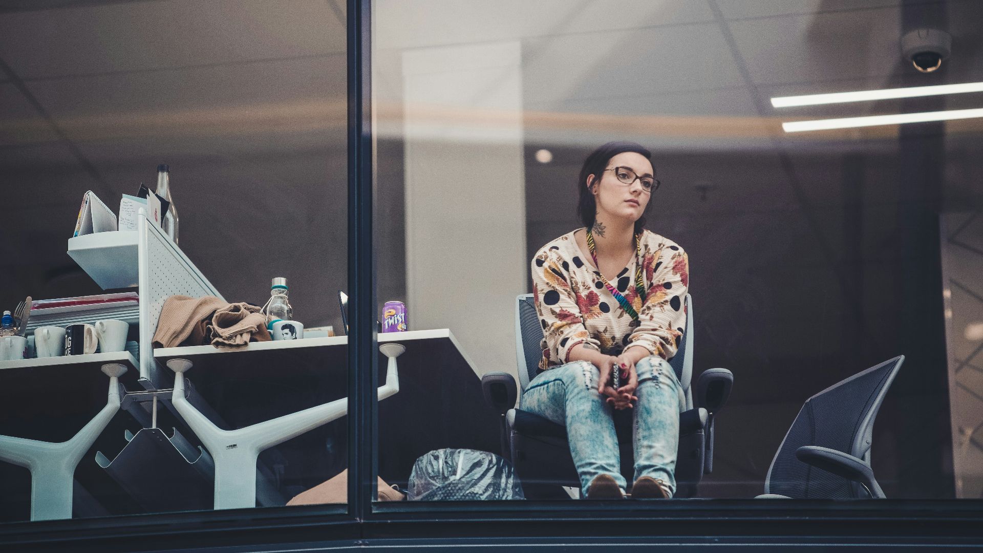woman sitting on chair beside table