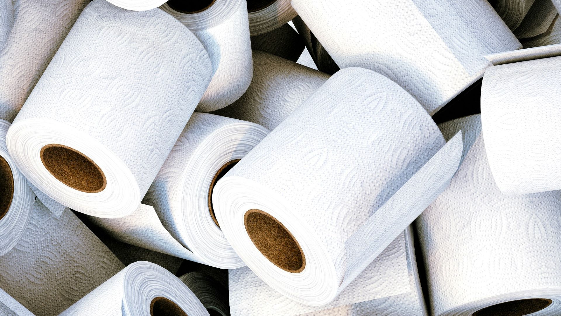a pile of white toilet paper sitting next to each other