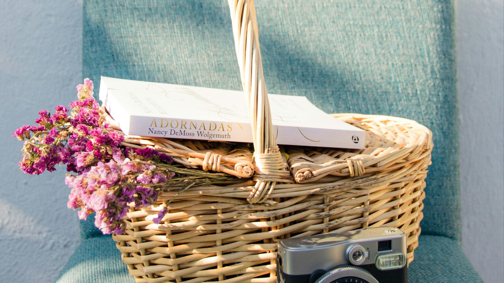 green towel on brown woven basket
