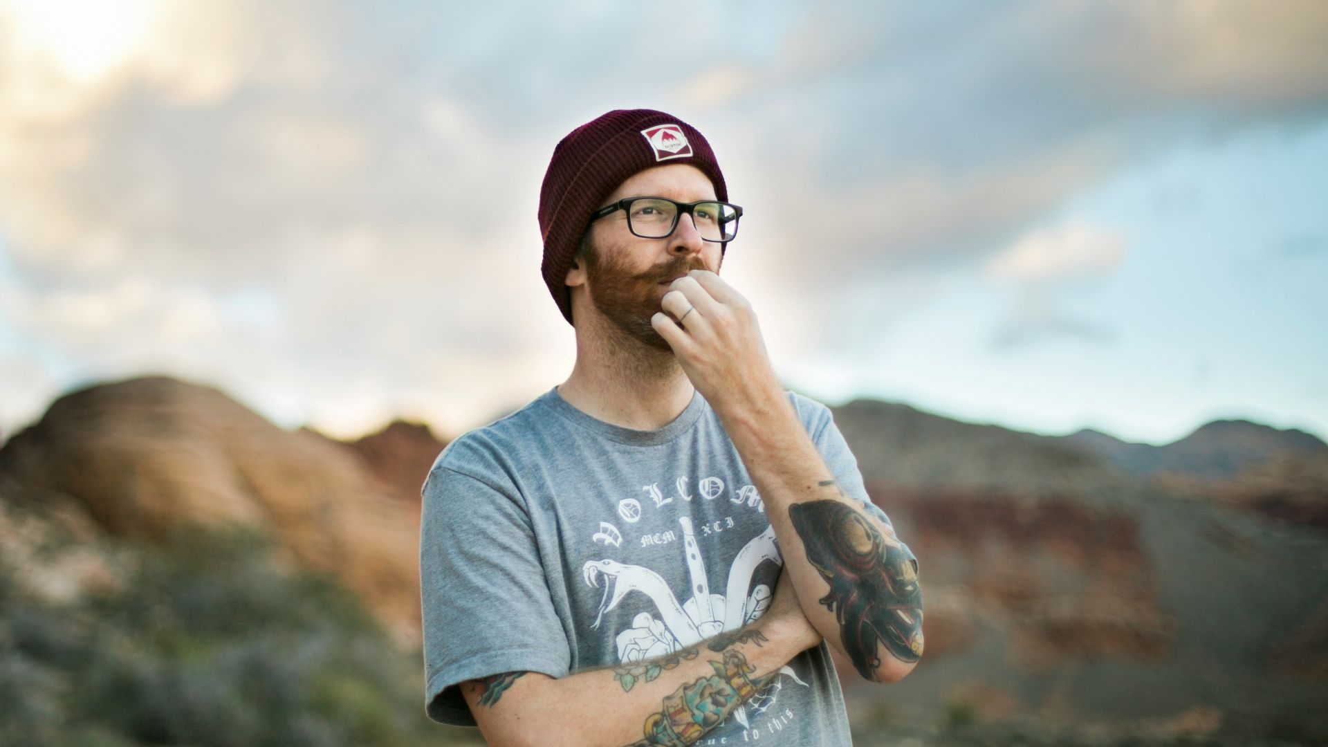 woman in blue crew neck t-shirt wearing black sunglasses