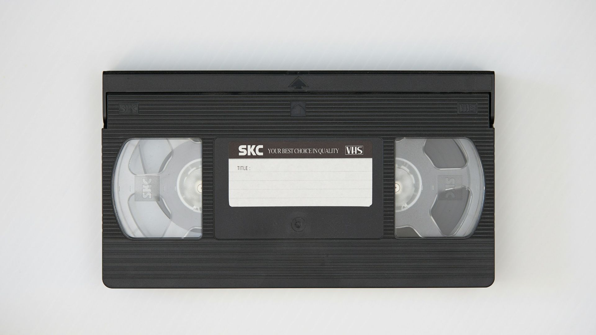 black cassette tape on white textile