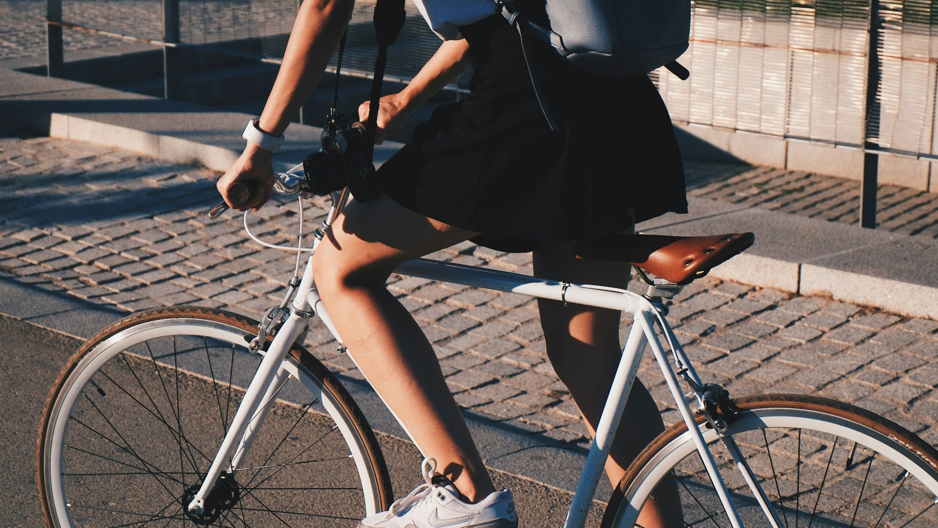 woman riding white rigid bike