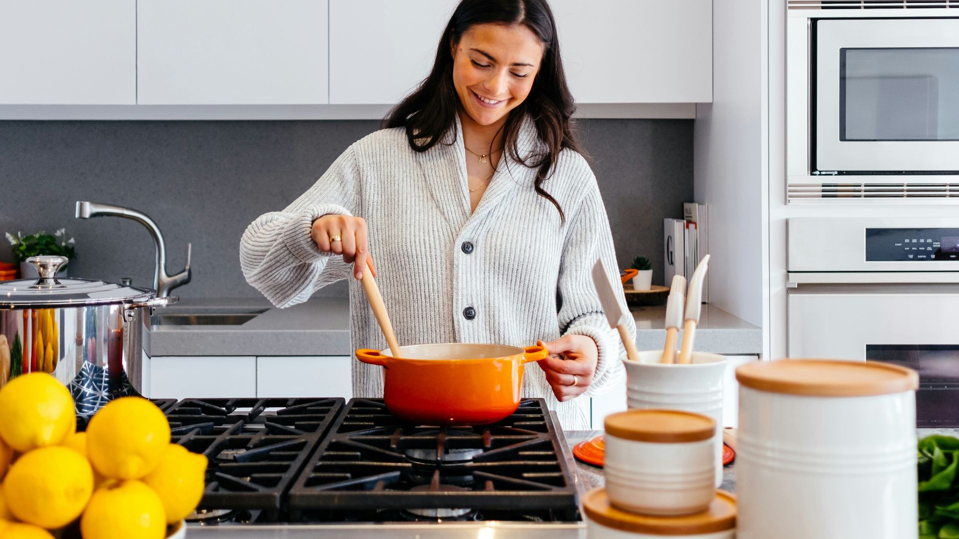 woman cooking inside kitchen room