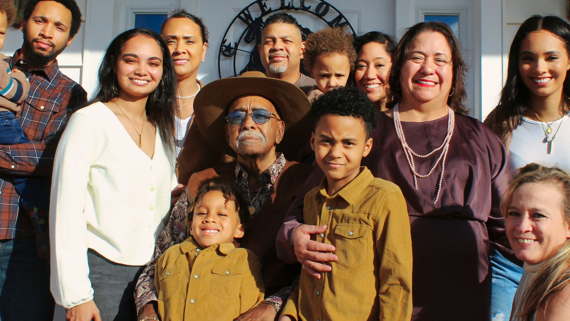 group of people standing near white wall