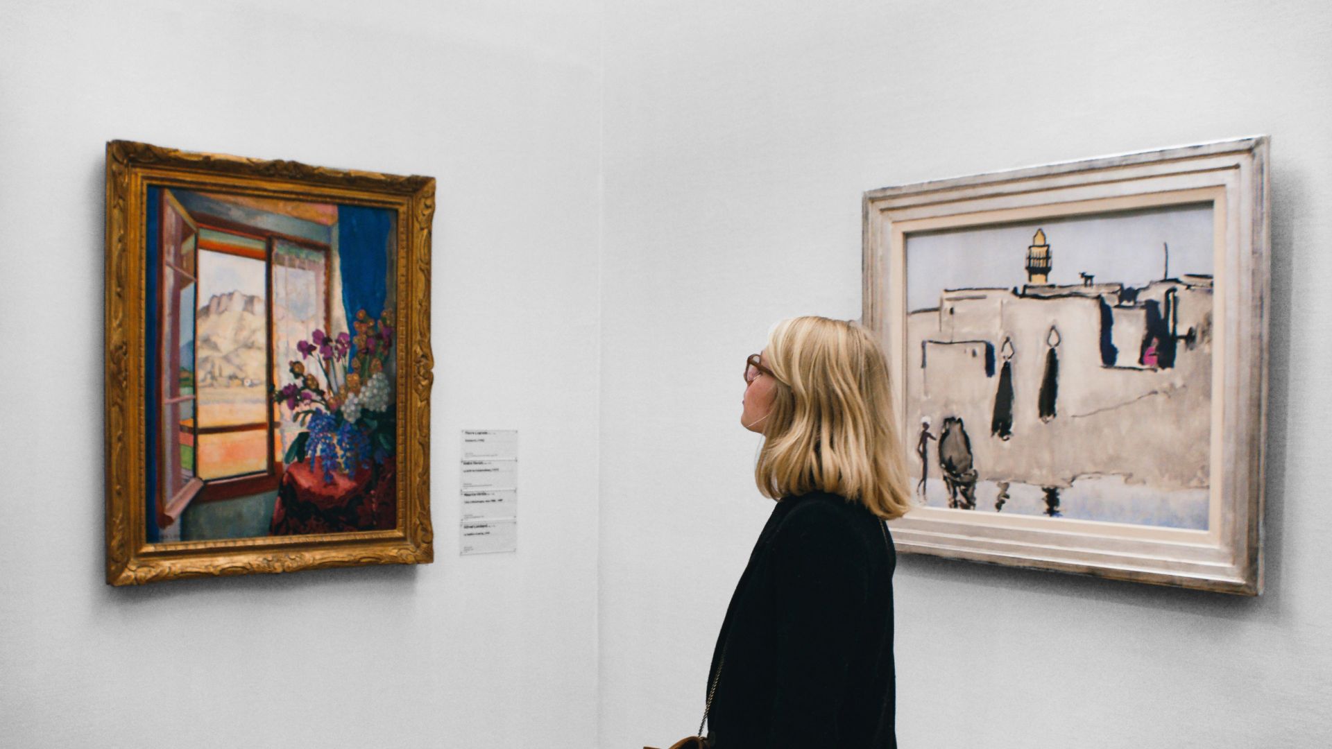 woman looking at painting