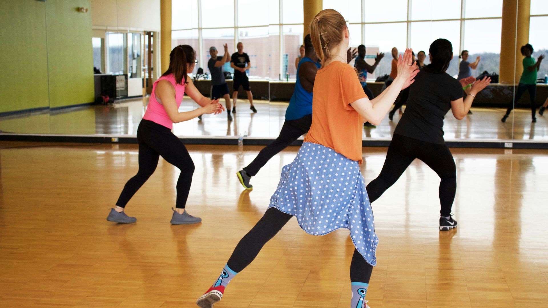 women dancing near mirror