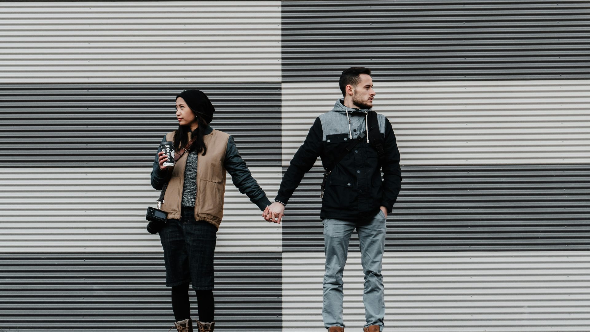 man and woman holding each other's hands