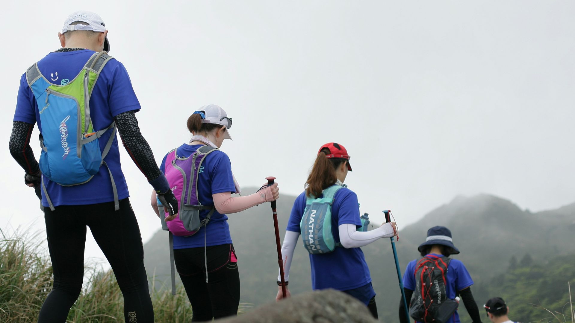 people standing on rock during daytime