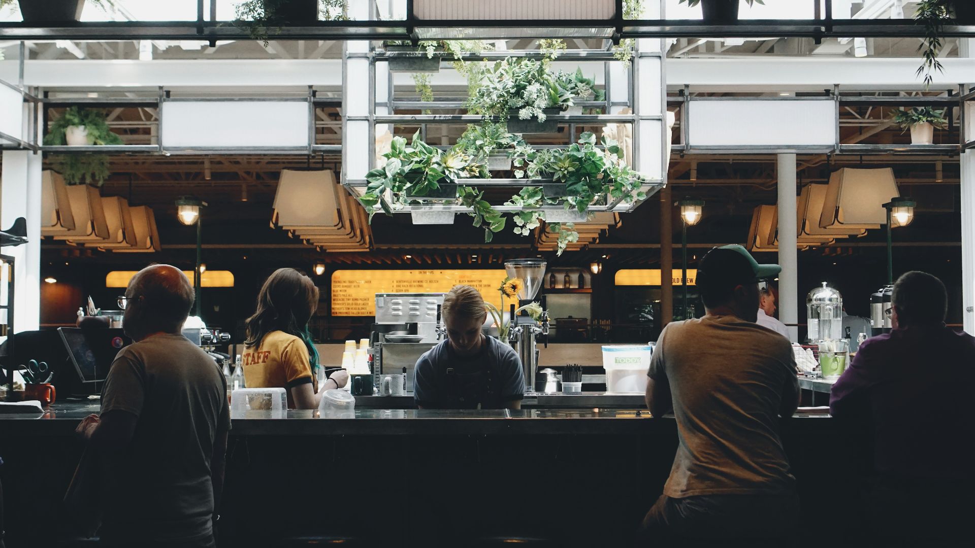 people sitting near stall