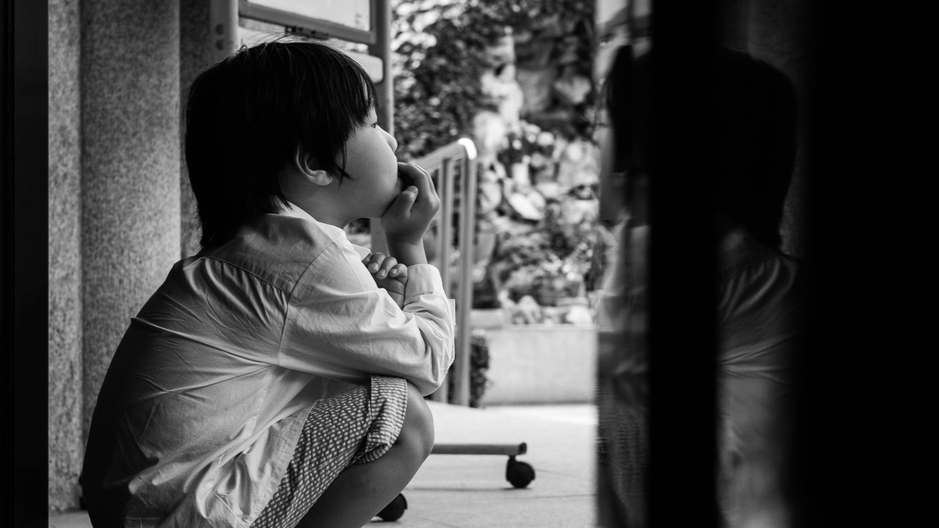 child sitting at the entrance