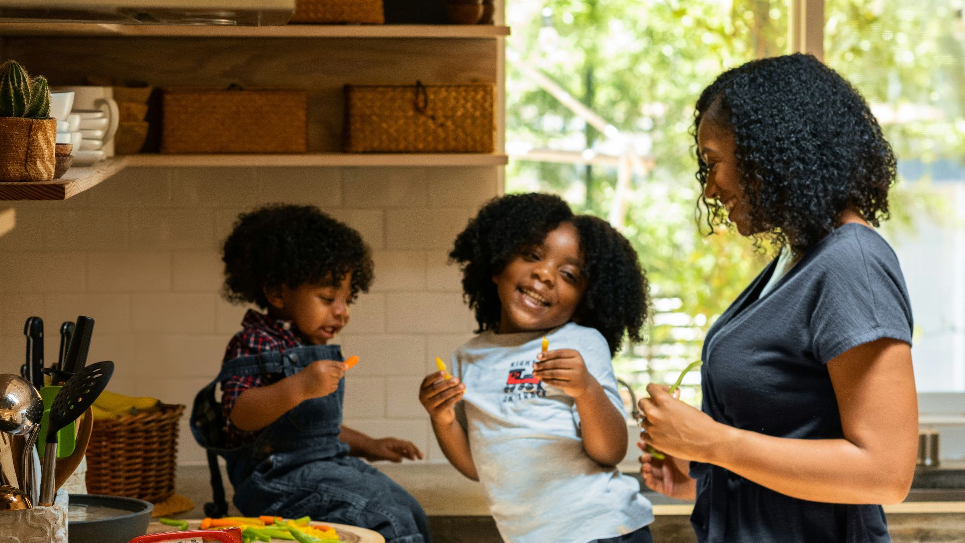 woman in white t-shirt standing beside woman in black and white stripe shirt
