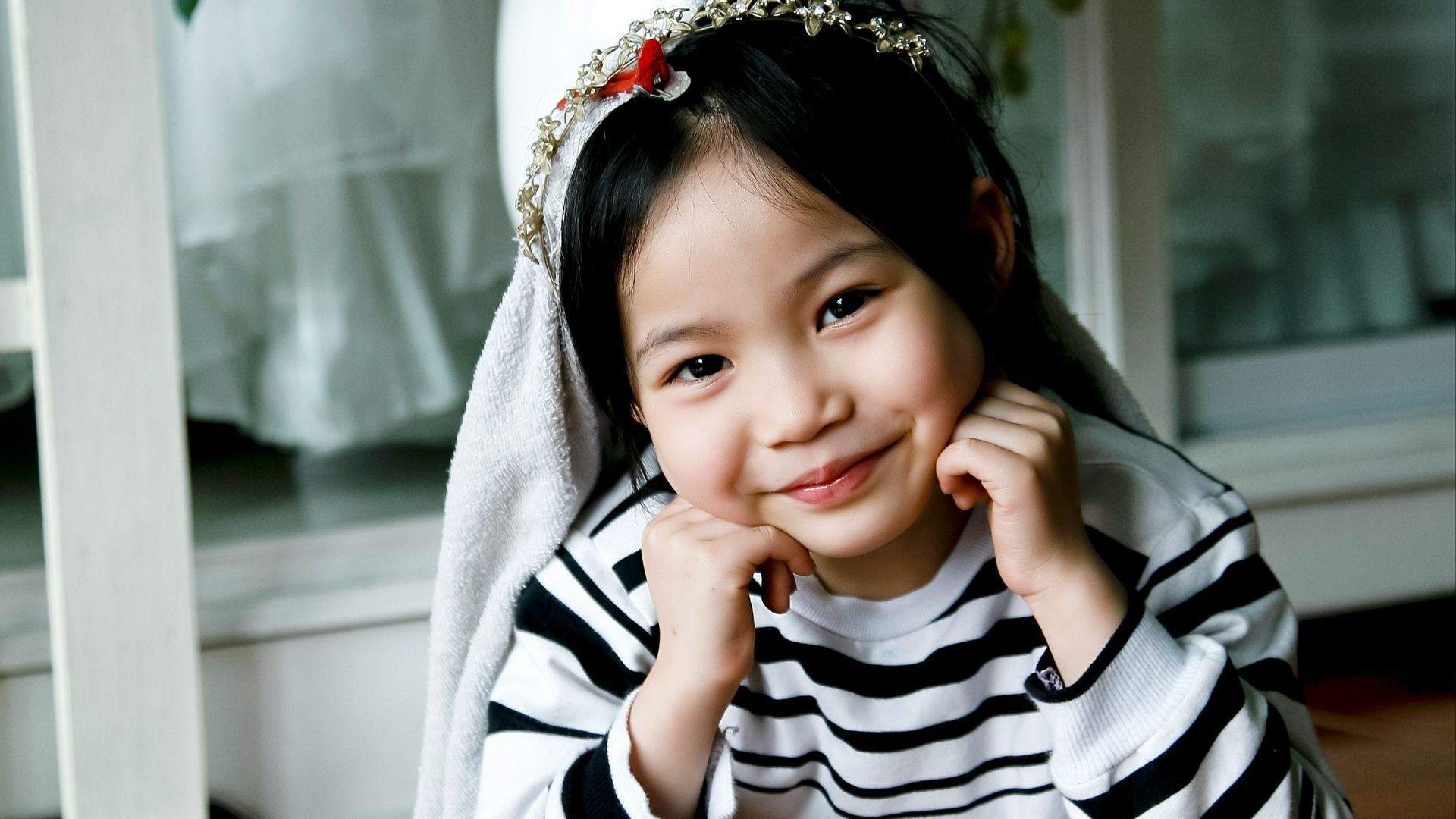 girl in white and black sweater taking photo