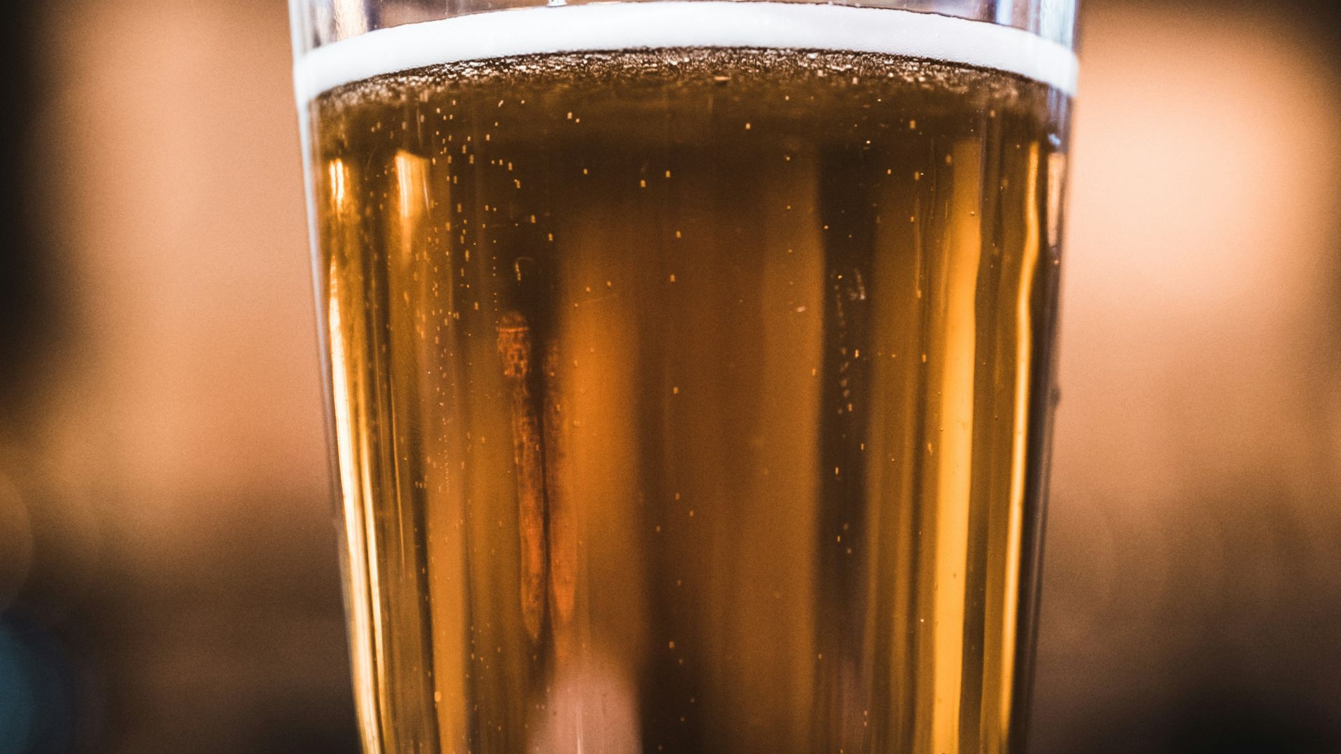 clear drinking glass filled with yellow liquid