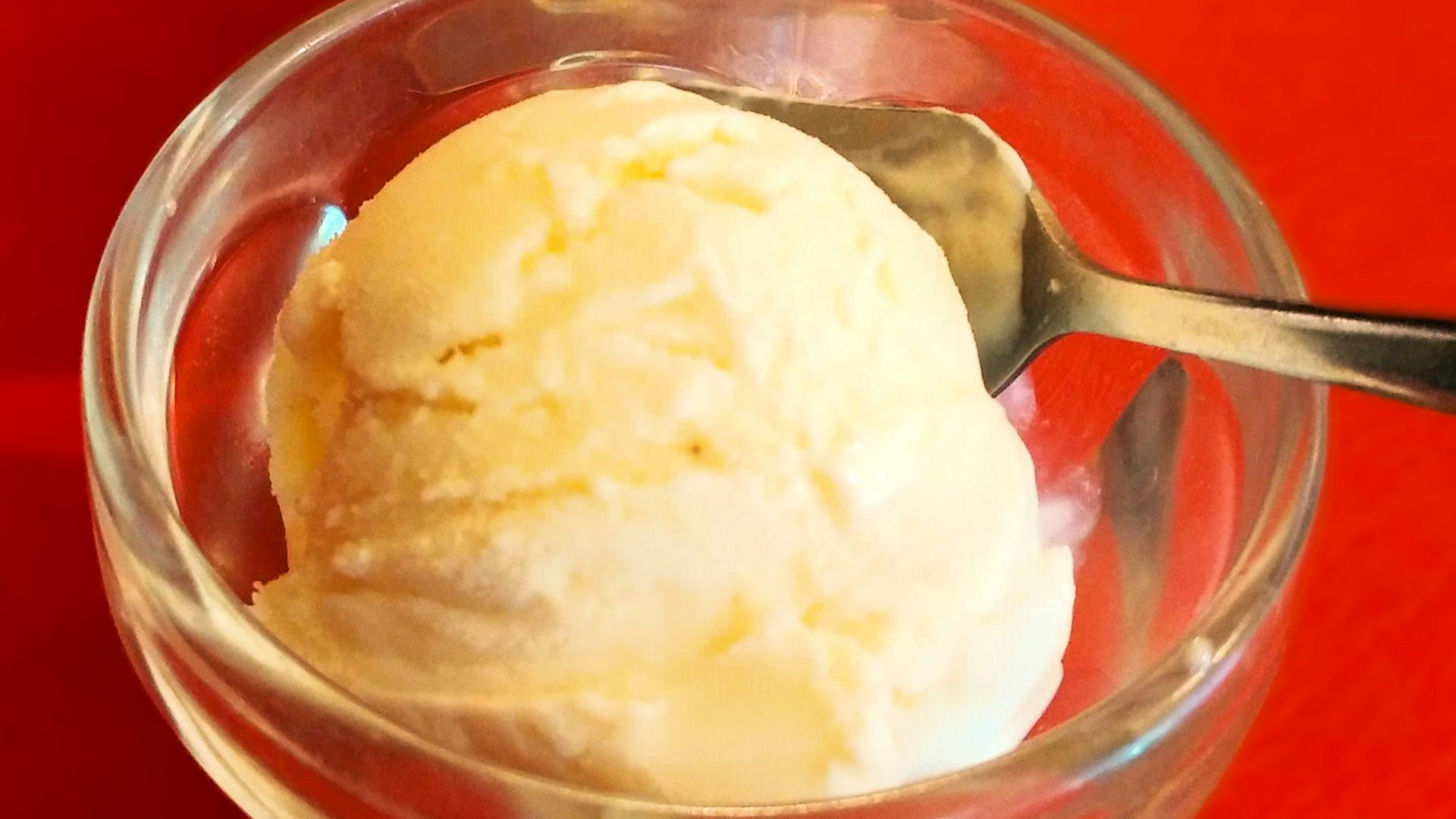two bowls of ice cream on a red table
