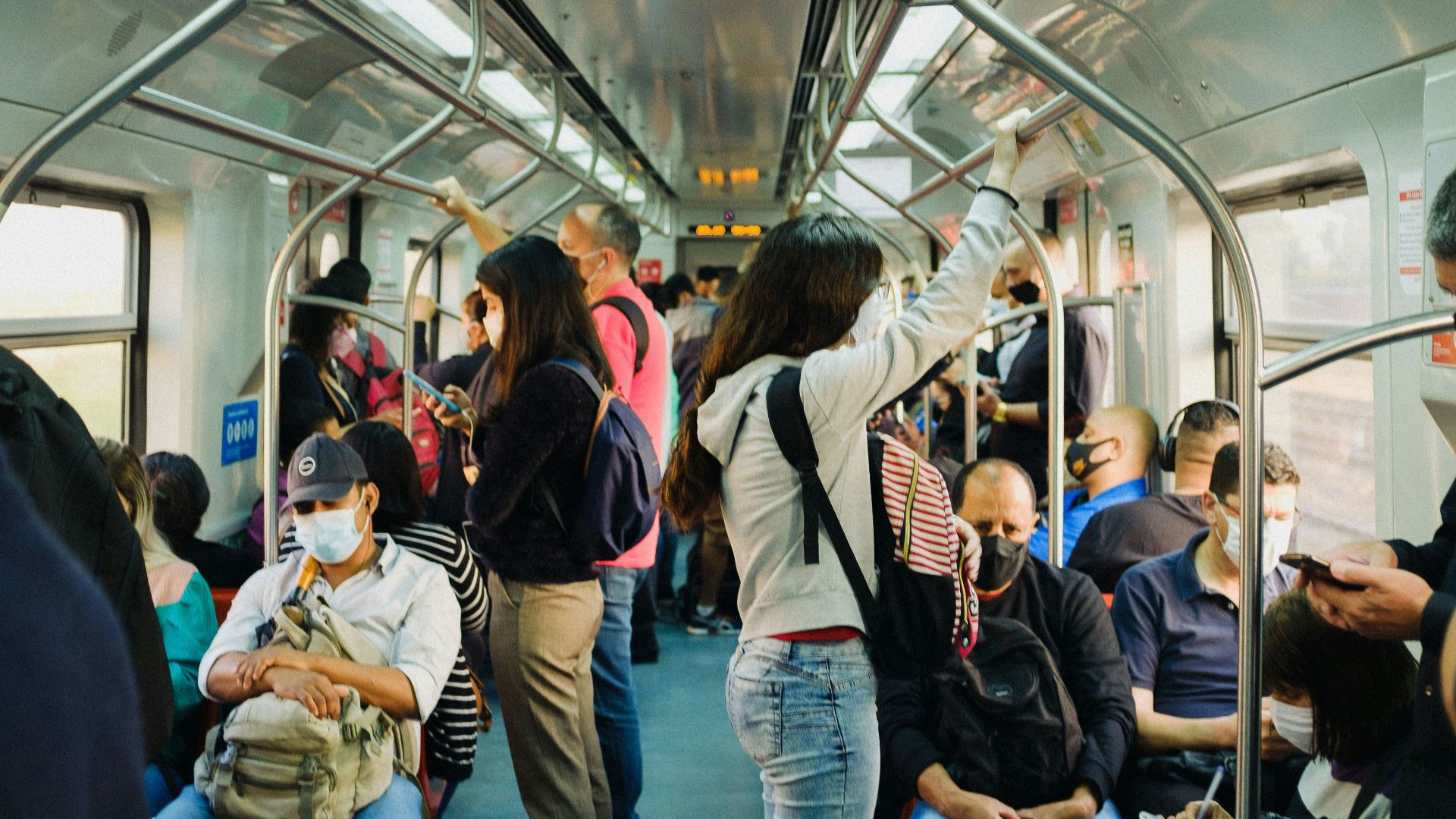 people in train during daytime