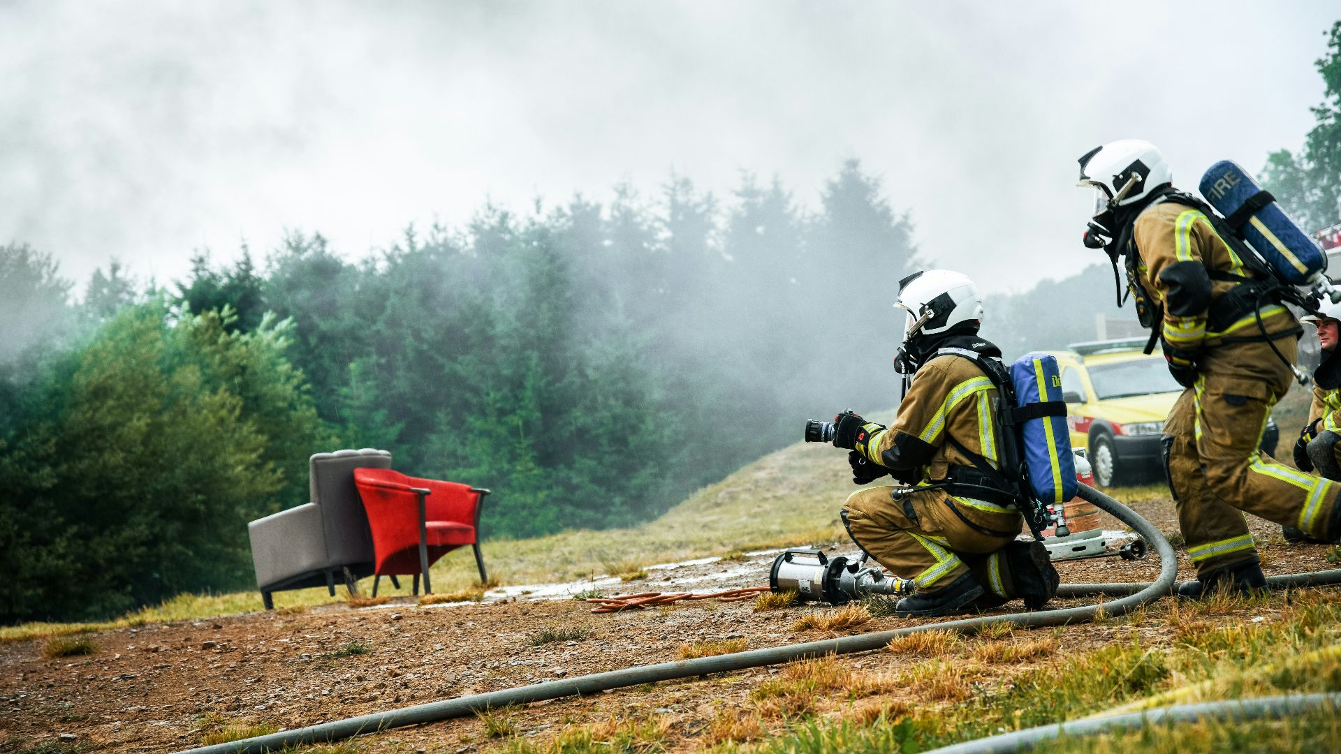 a group of fire fighters working on a fire