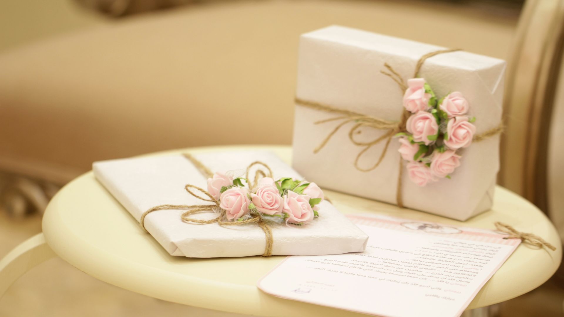 two pink and white floral boxes
