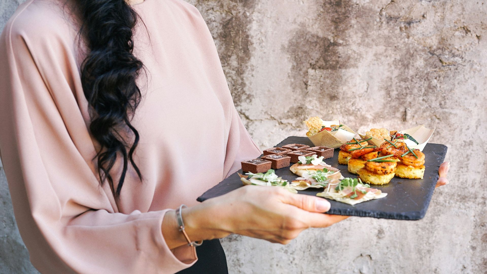 person holding tray with foods