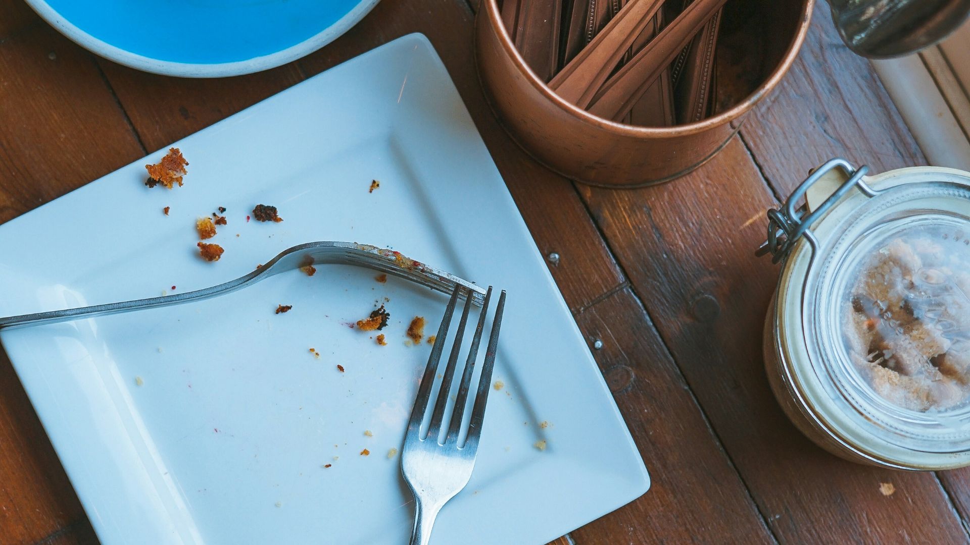 fork and spoon on square white ceramic plate