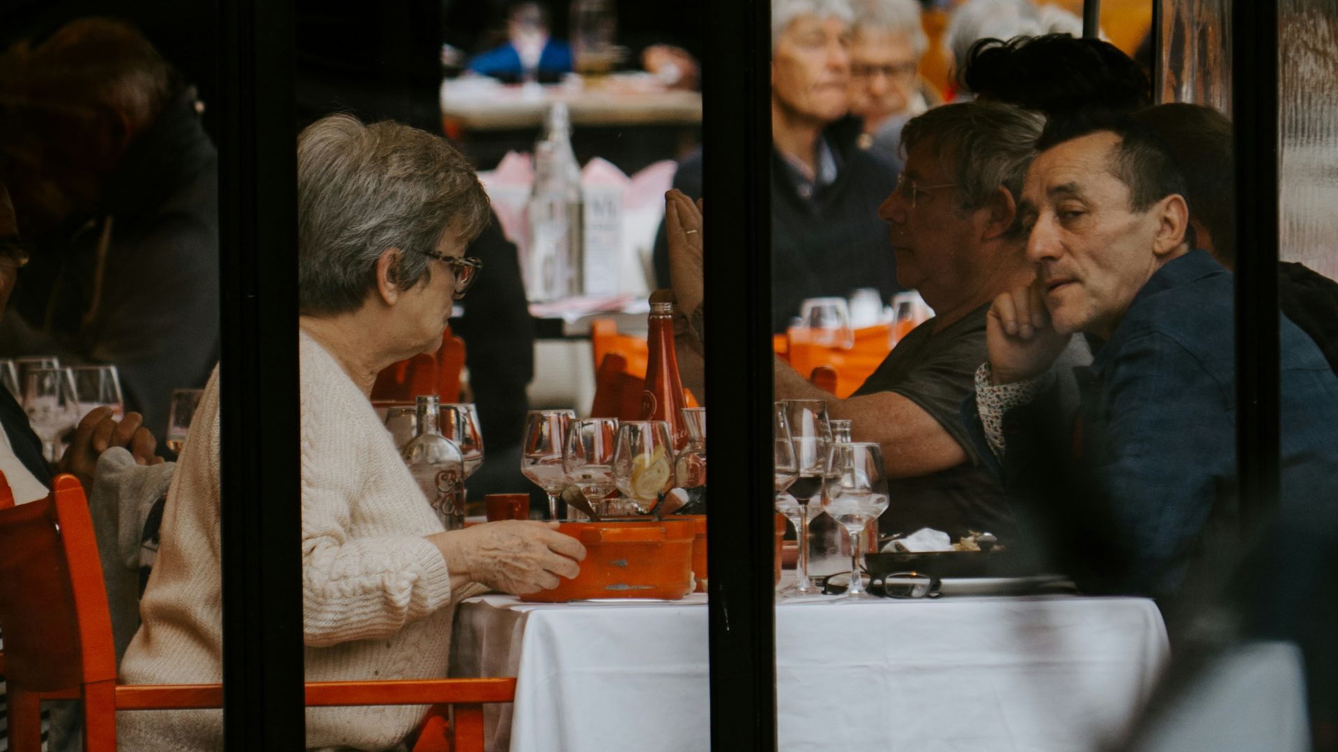 man and woman sitting at table during daytime