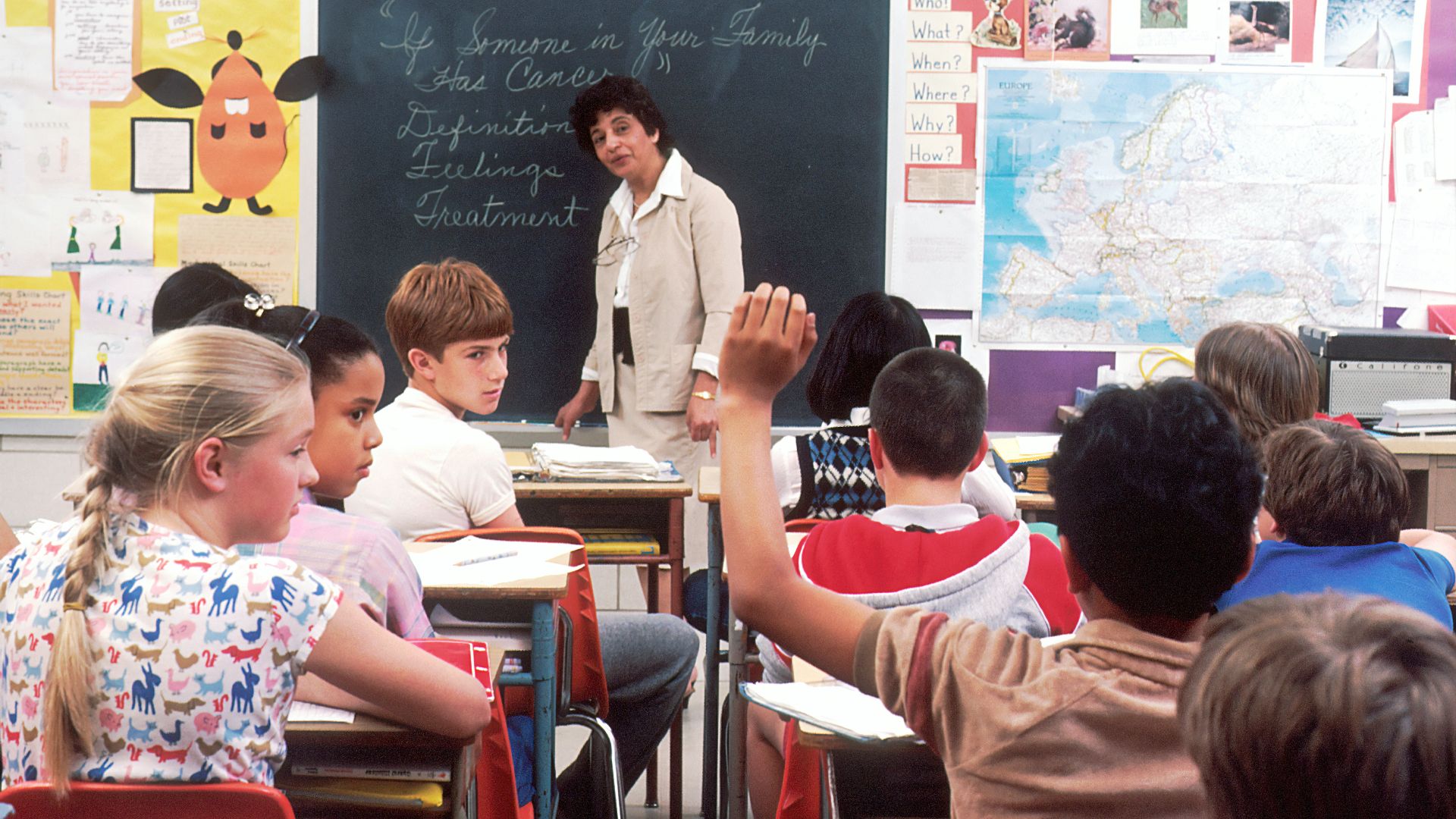 woman standing in front of children