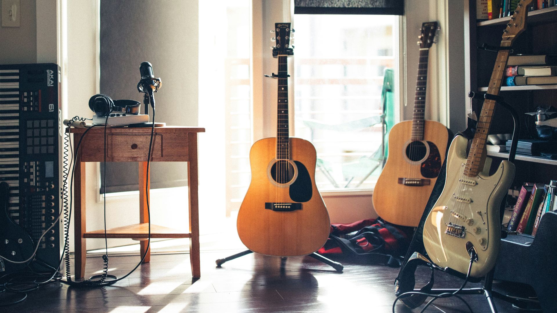 several guitars beside of side table
