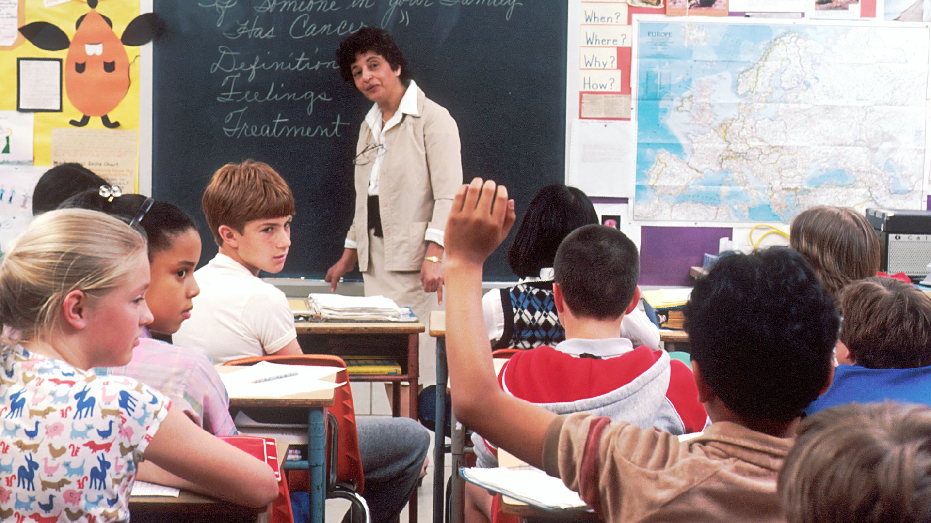 woman standing in front of children