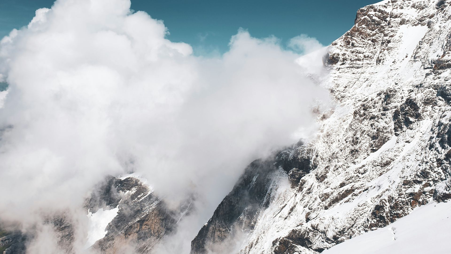 snow covered mountain under blue sky during daytime