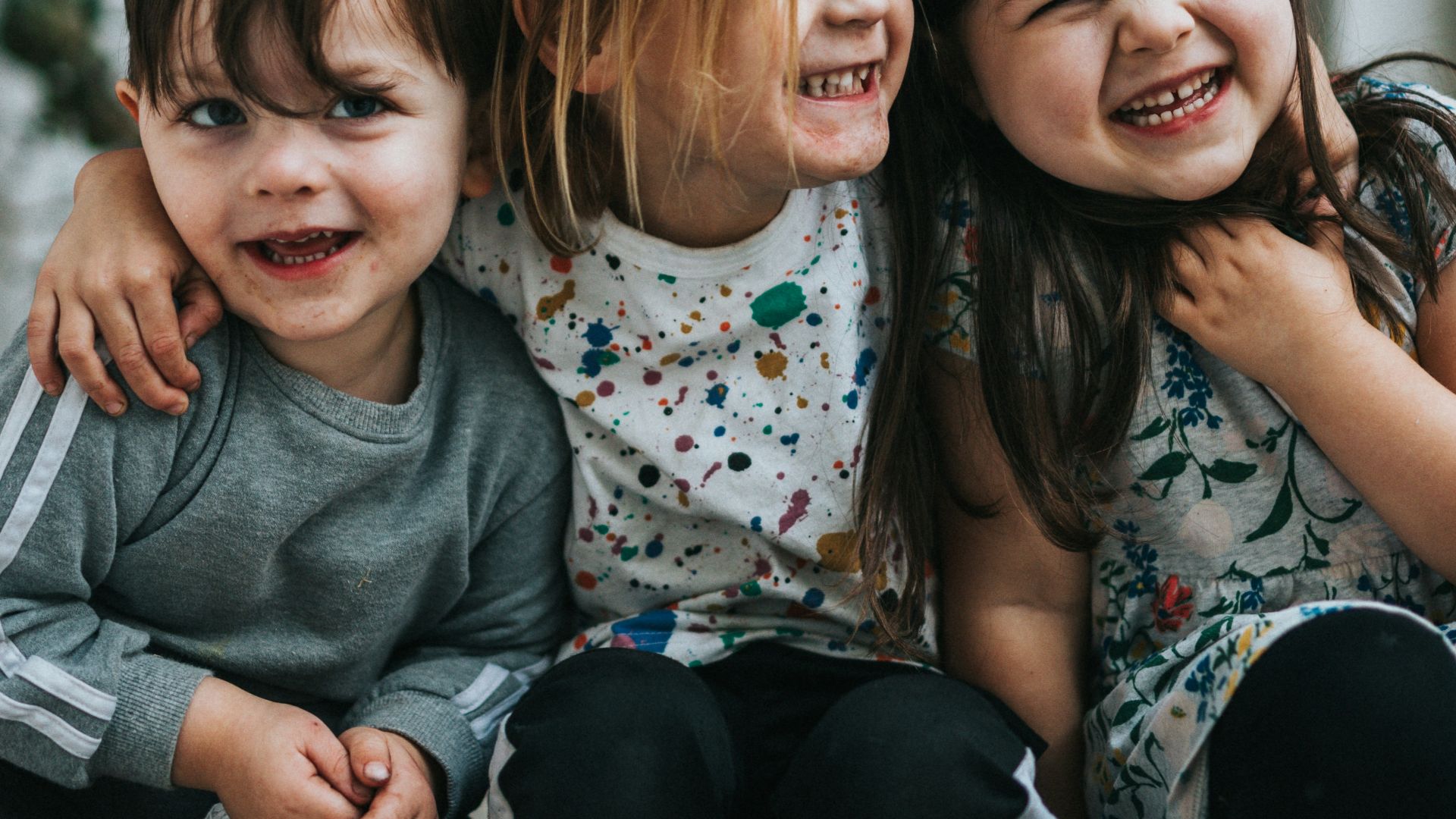 2 girls sitting on floor