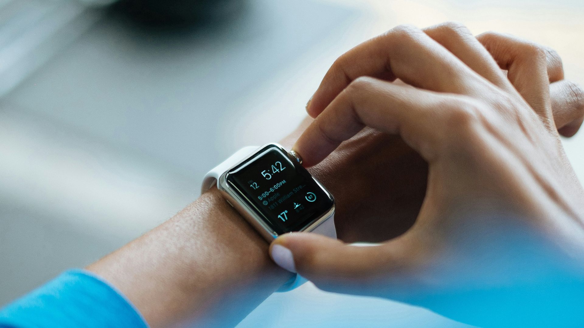 person clicking Apple Watch smartwatch