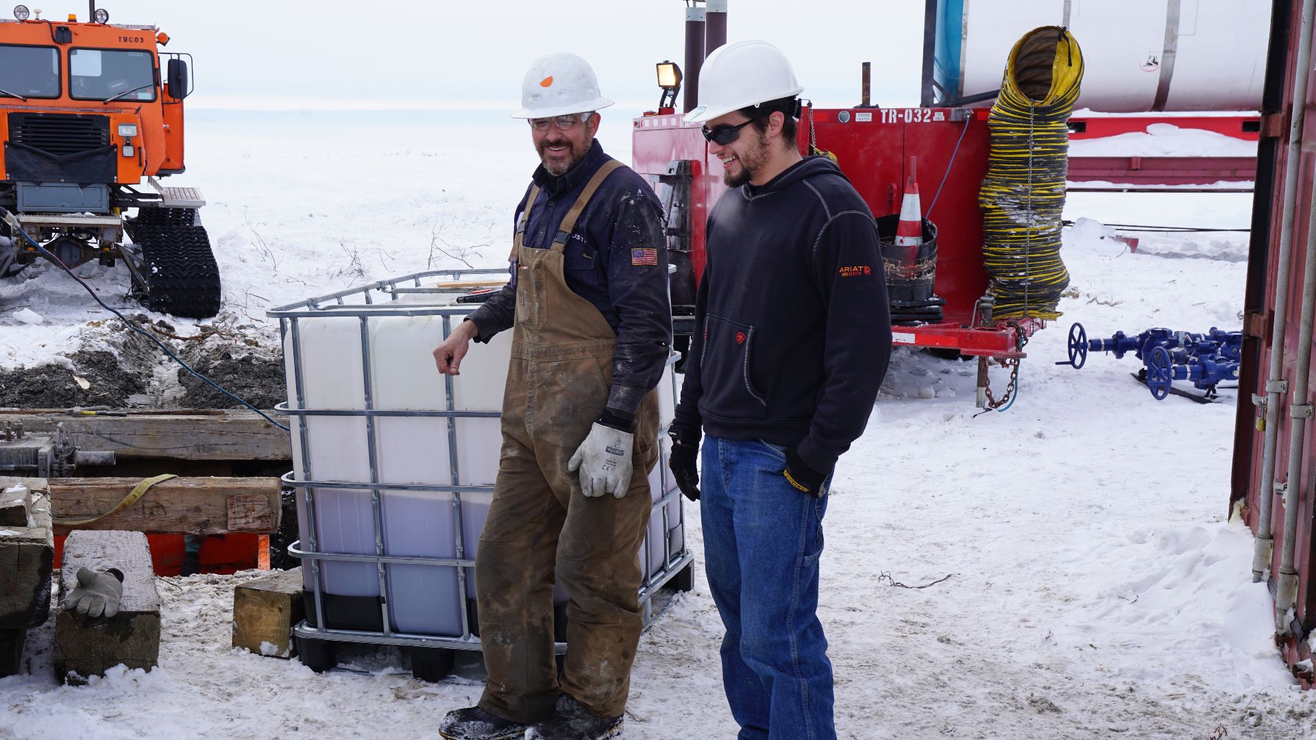 File:BLM Alaska Petroleum Engineer Technician Quinn Sawyer speaks with contract crew member at well site (27176991327).jpg