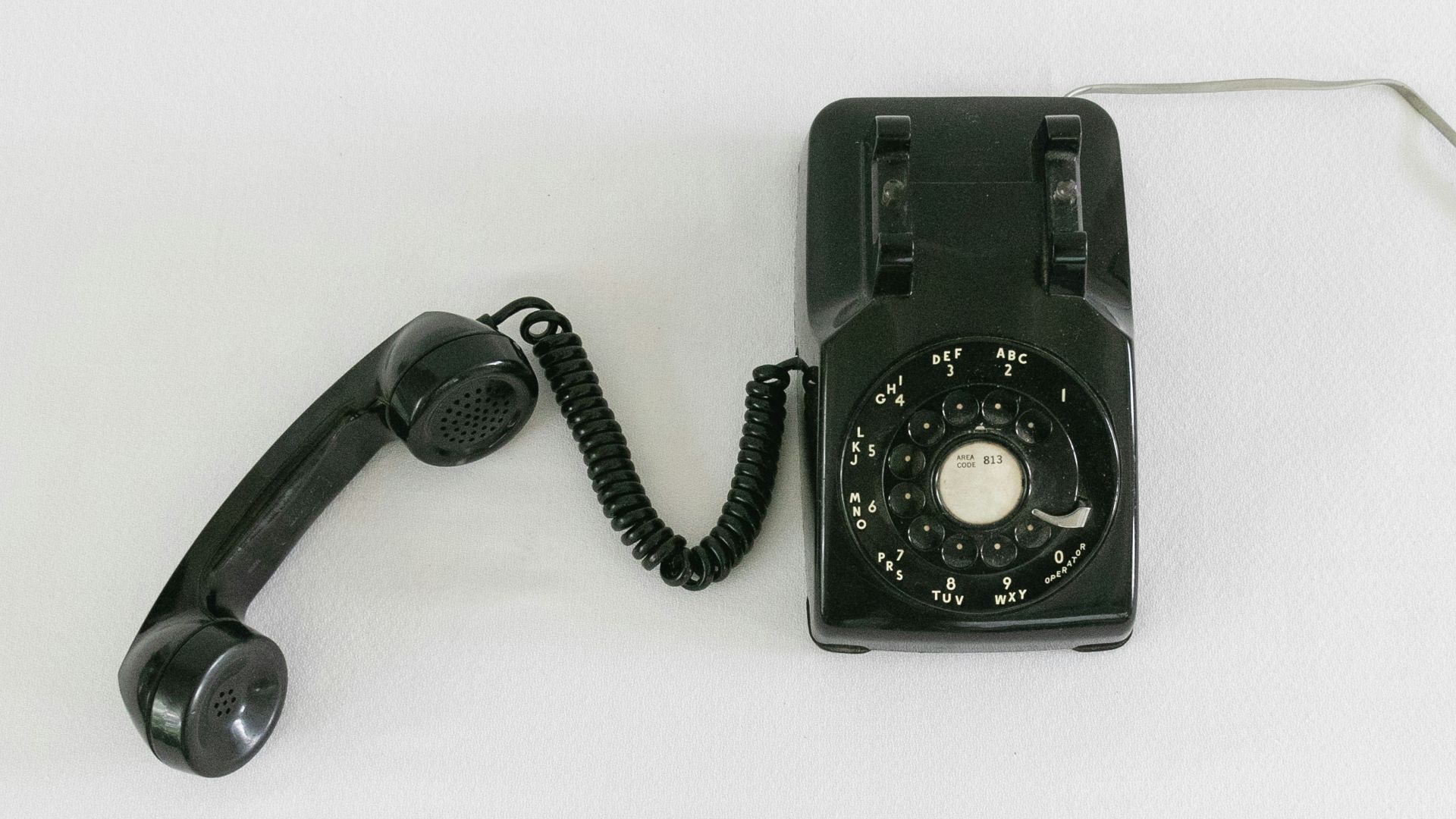 black and silver rotary phone