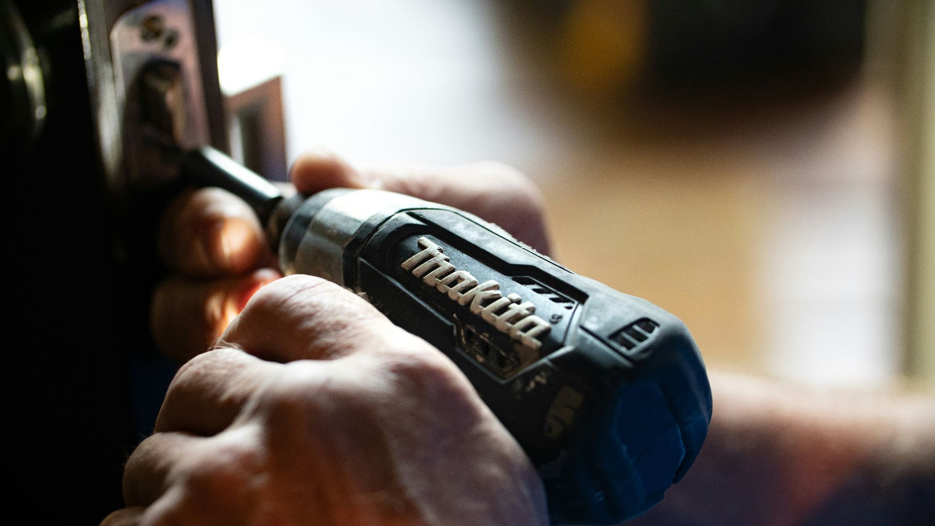 selective focus photography blue and black Makita power drill