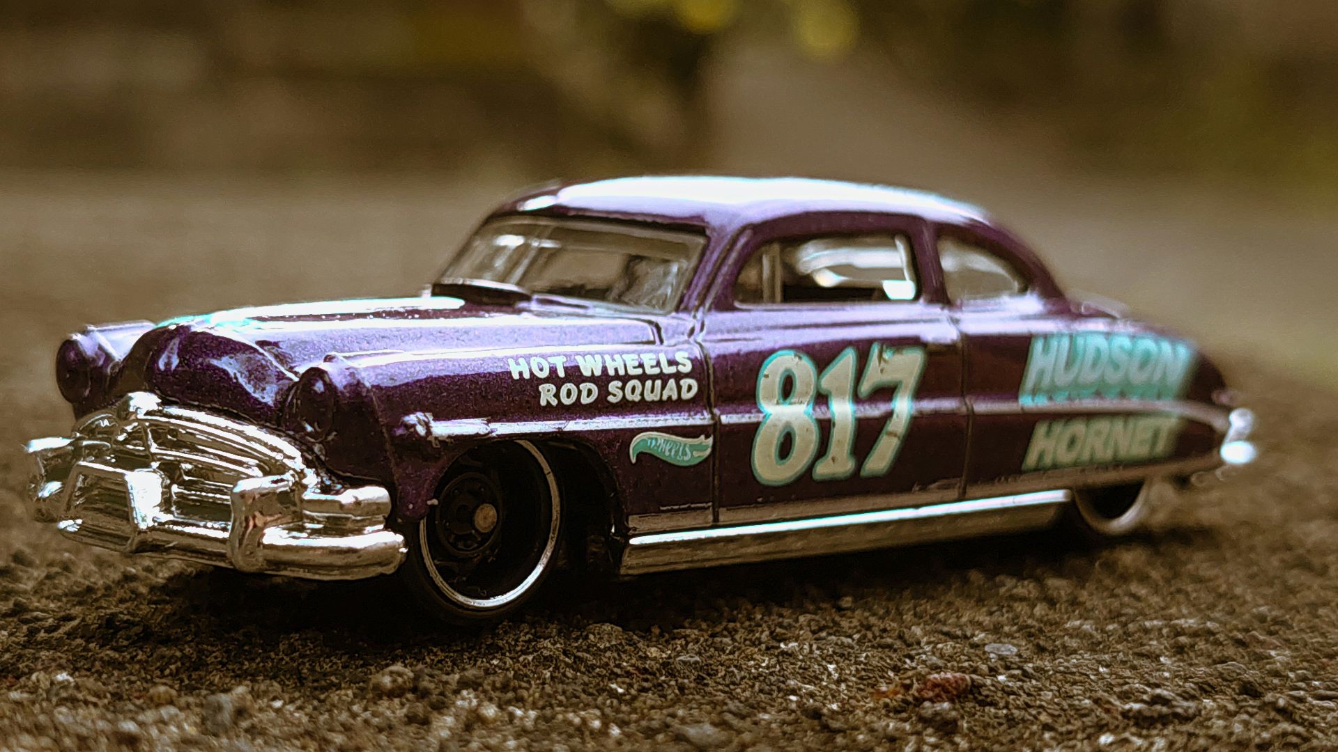 a car driving on a dirt road