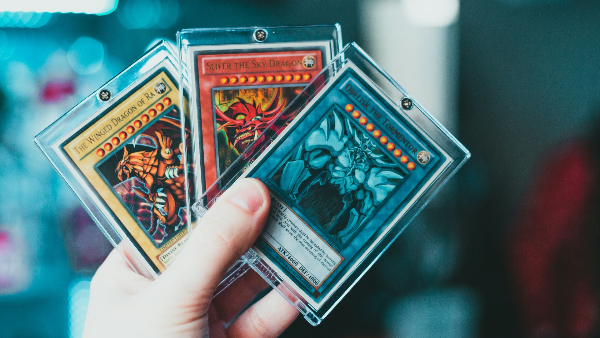 person holding yu gi oh trading card