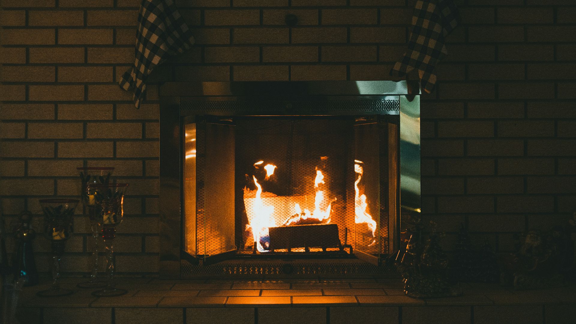 brown brick fireplace with brown brick wall