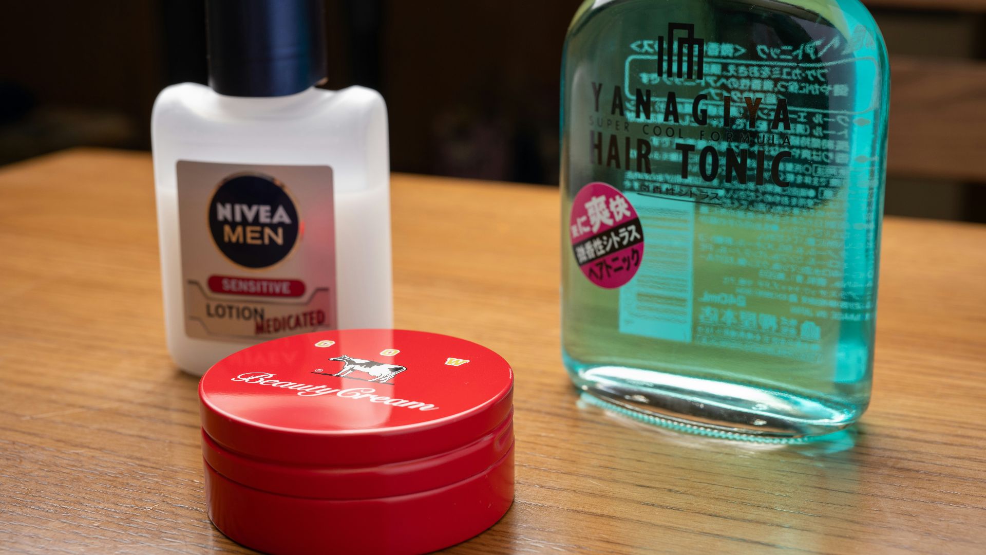a bottle of nivea men and a container of lotion on a table