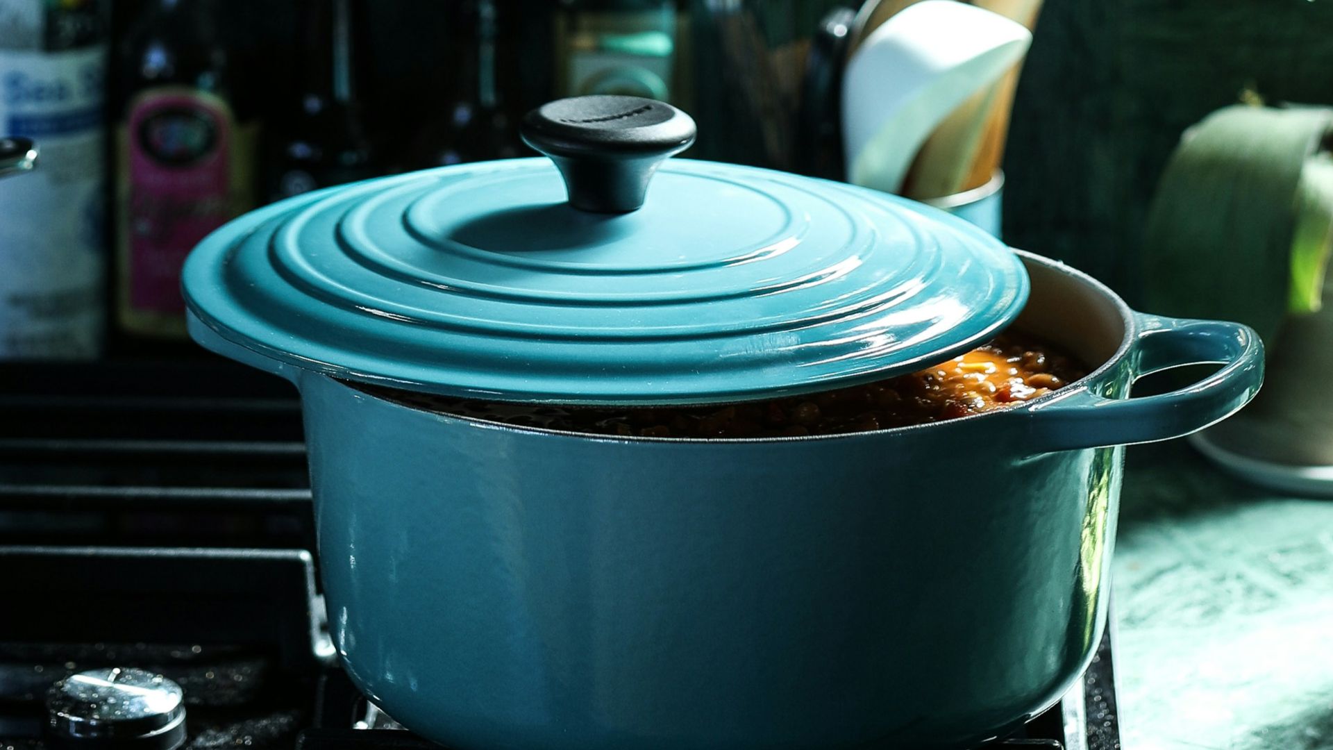 partly opened blue metal pot on stove