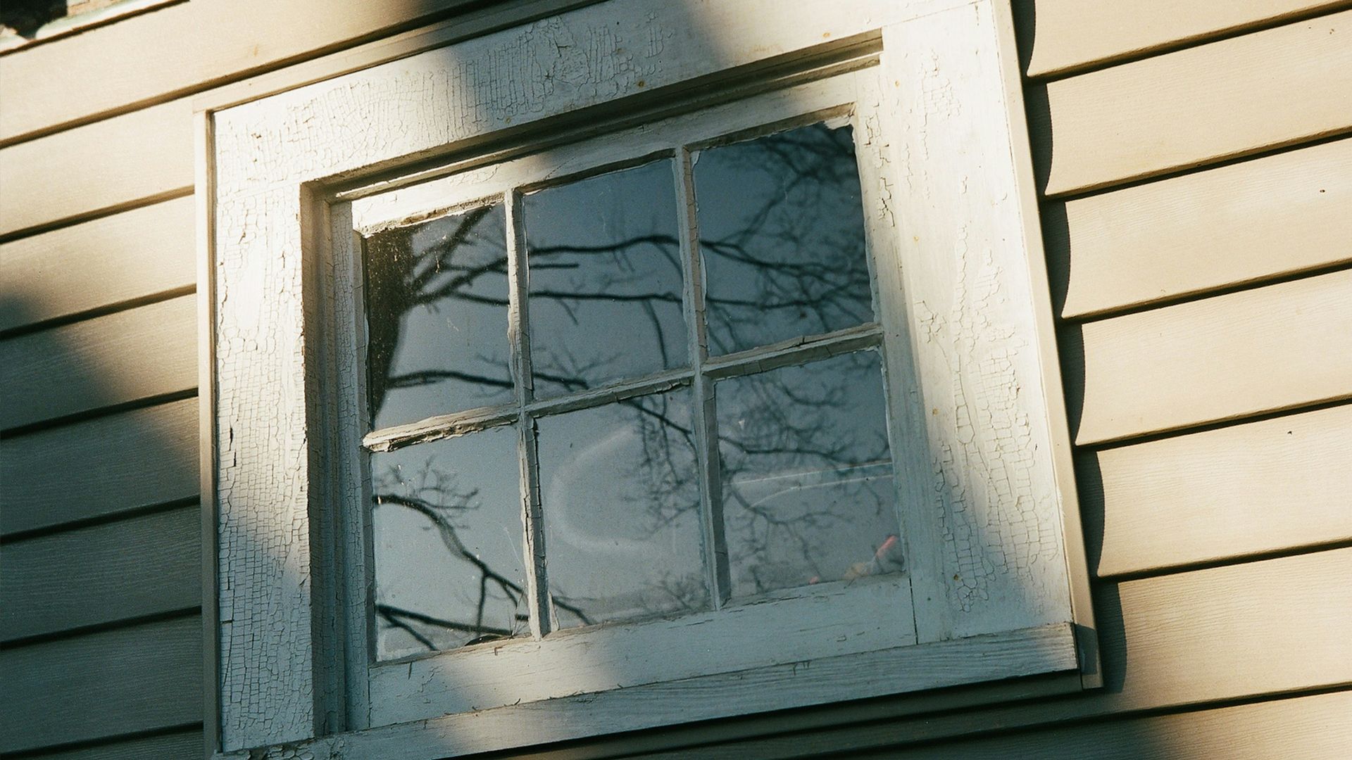 a window on the side of a house