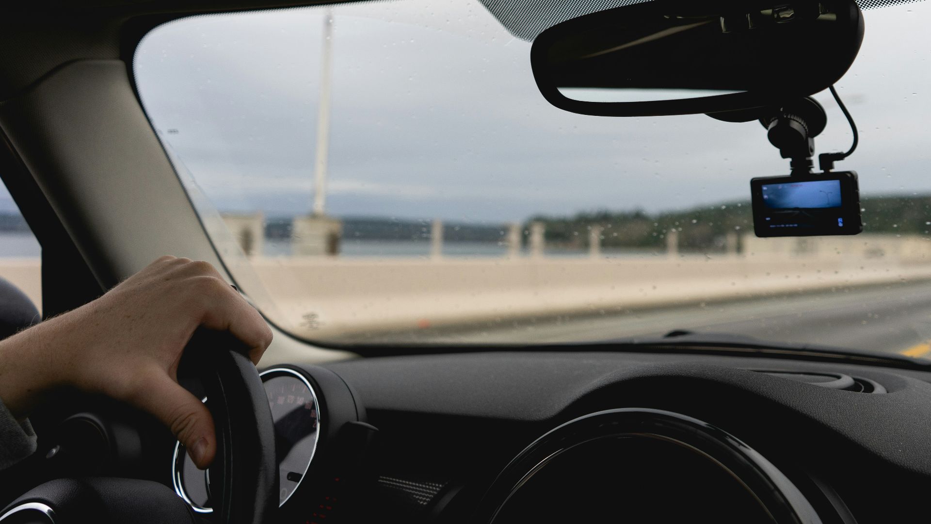 a person driving a car on a highway