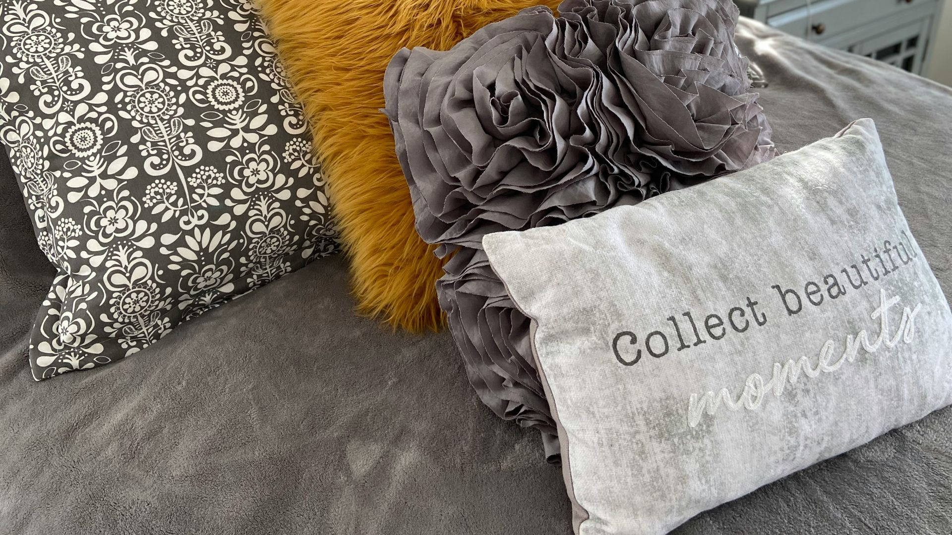 gray and white throw pillows on orange throw pillow