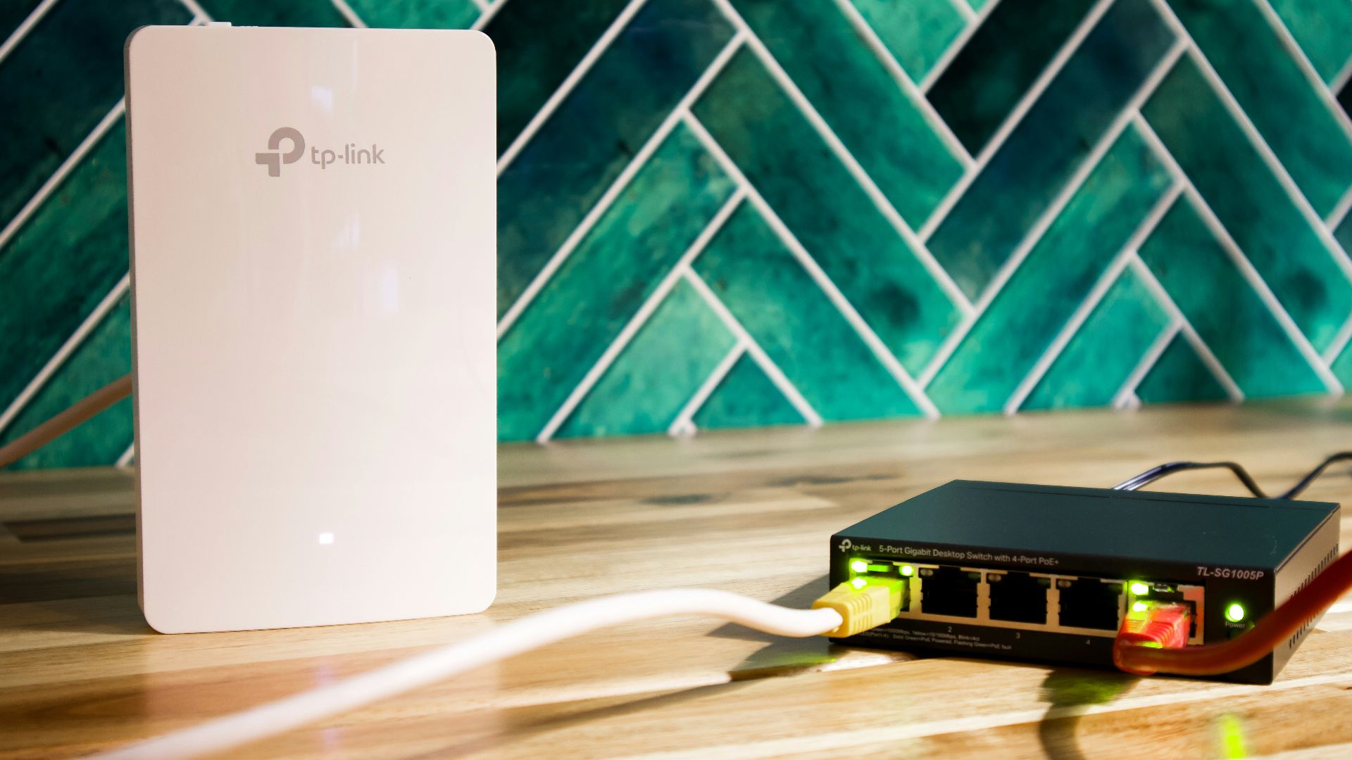 A wi-fi router and a network switch sit side-by-side.
