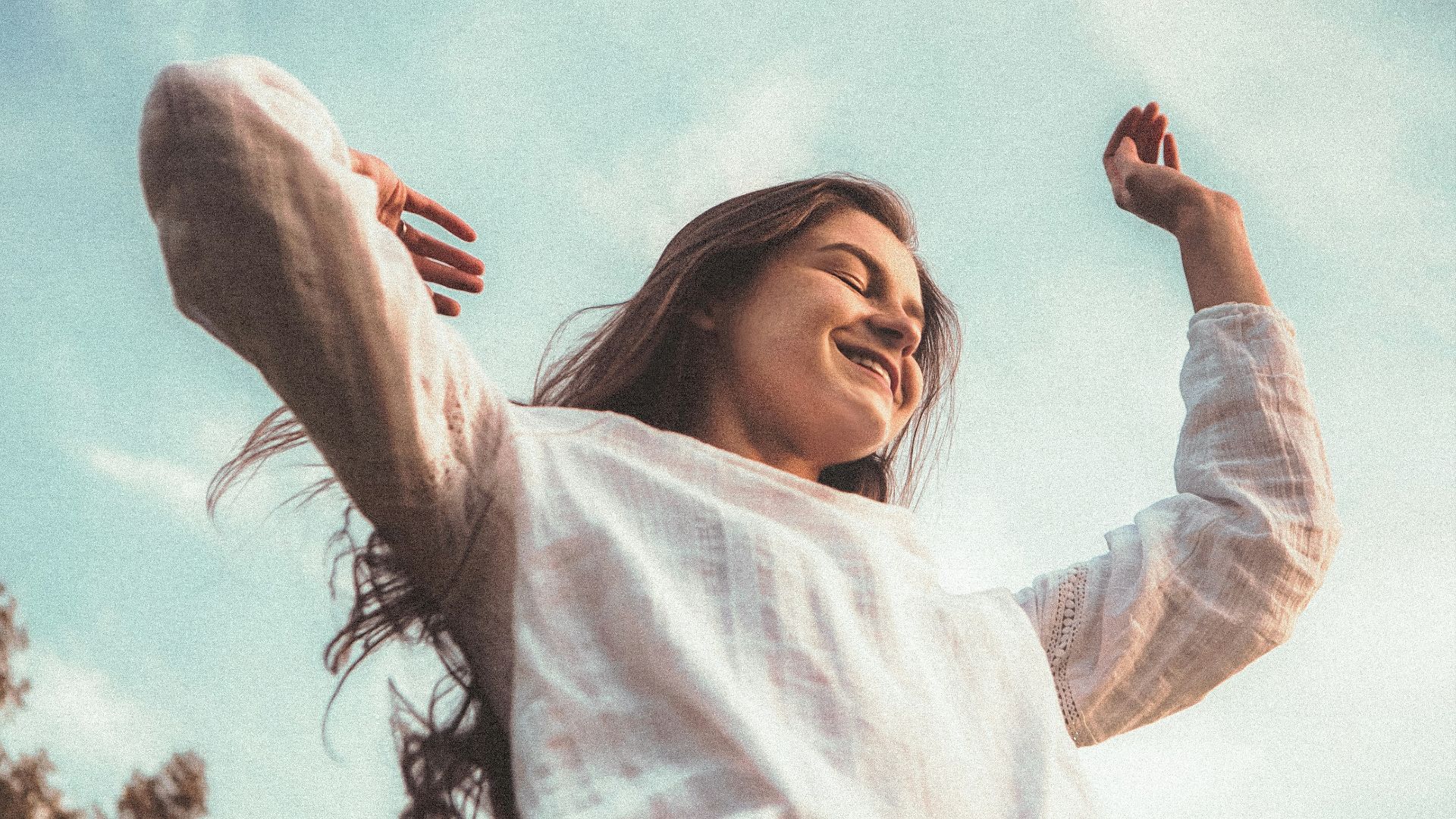 woman in white long sleeve shirt and blue denim jeans